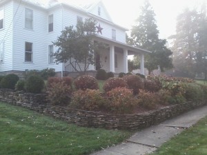 Front yard plantings and terraced retaining wall