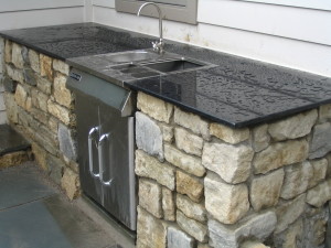 Outdoor Kitchen with Black Granite and Stainless Steel Sink located in Middle Town NY.